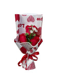 Bouquet of red roses wrapped in white paper with red hearts QATAR PRICE