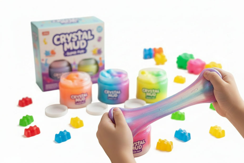 Child playing with colorful Crystal Mud slime on a table with packaging in the background. QATAR PRICE