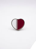 Heart-shaped pin with Qatar flag design on a white background QATAR PRICE