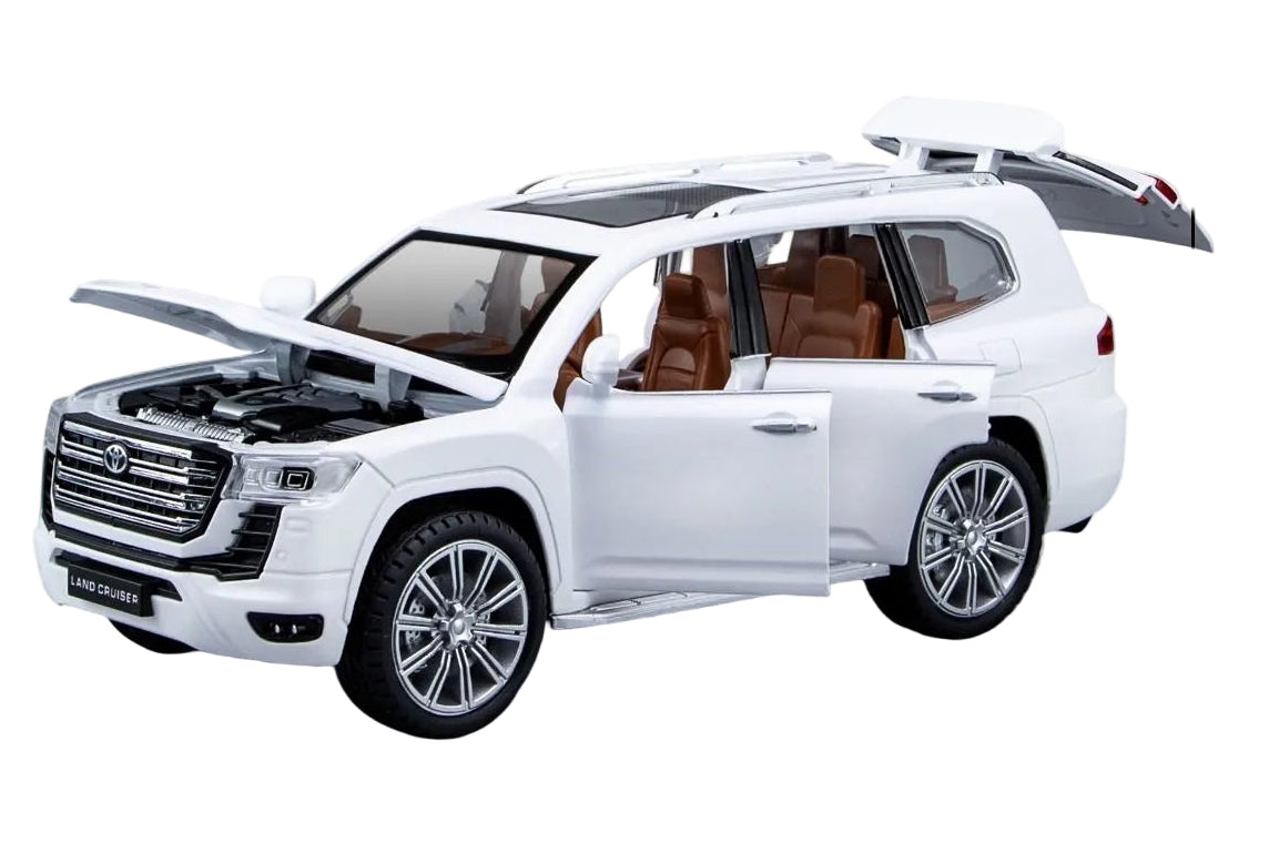 Model toy car of Land Cruiser LC300 with packaging and specifications on a white background QATAR