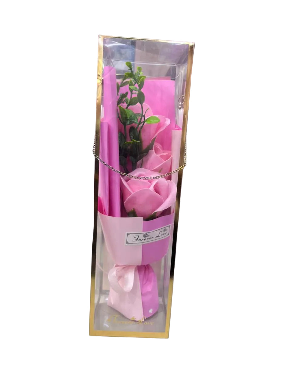 Pink toy fish in a clear box on a white chair with a colorful background QATAR PRICE