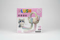 Plush toy packaging with a cat design held by a hand in a store setting QATAR RICE