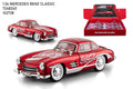 Red Mercedes-Benz classic model car with Coca-Cola branding next to its packaging on a white background.QATAR