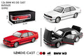 Three BMW M3 model cars in red, white, and black with packaging on a white background.QATAR