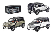 Three diecast models of Range Rover vehicles on a white background with packaging.QATAR