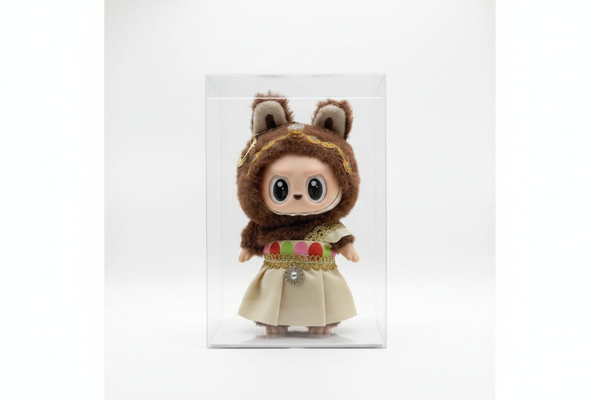 Toy figure with a hat and coat next to its packaging on a white background QATAR PRICE