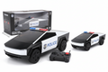 Toy police car with remote control and packaging on a white background